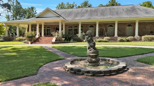 a front view of a house with a yard table and chairs