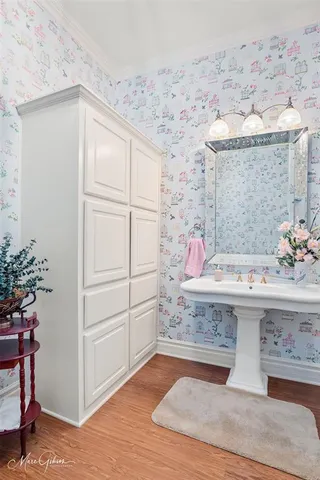 a view of bathroom with a sink and mirror