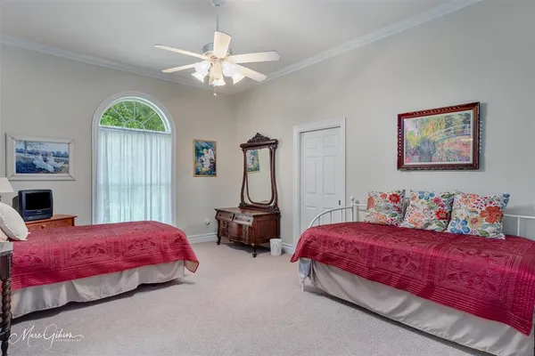 a bedroom with bed and window