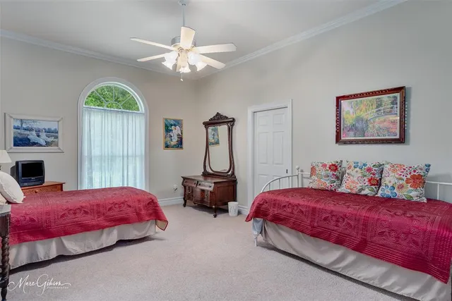 a bedroom with bed and window