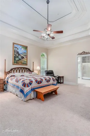 a bedroom with bed and window