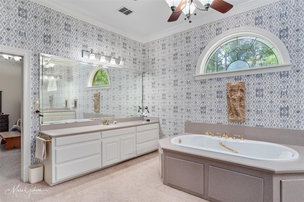 3669 Fountainbleau Road Keithville, LA 71047 - Photo 38 of 40 a bathroom with a sink and a large mirror