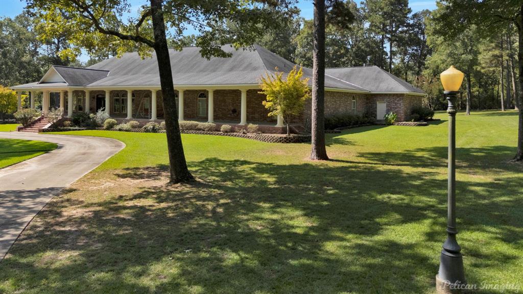 3669 Fountainbleau Road Keithville, LA 71047 - Photo 5 of 40 a view of a house with a yard patio and slide