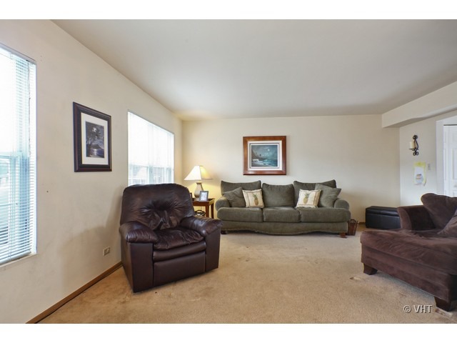 1844 Shetland Road Naperville, IL 60565 - Photo 2 of 10 a living room with furniture and a window