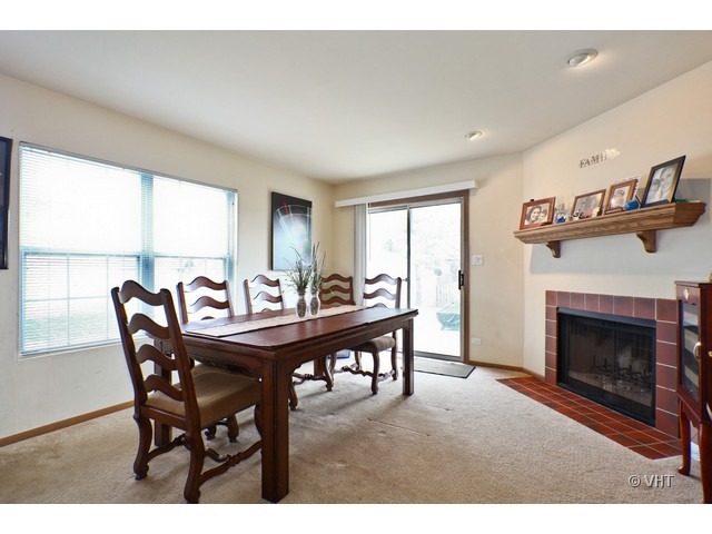 1844 Shetland Road Naperville, IL 60565 - Photo 5 of 10 a view of a dining room with furniture window and wooden floor