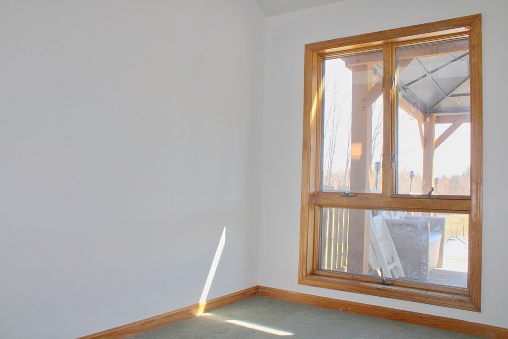 32 Hemlock Street Douglas, MA 01516 - Photo 16 of 41 a view of an empty room with wooden floor and a window