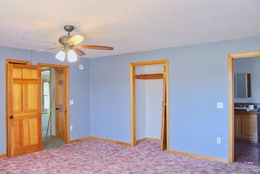 32 Hemlock Street Douglas, MA 01516 - Photo 18 of 41 a bedroom with a chandelier and a chandelier fan