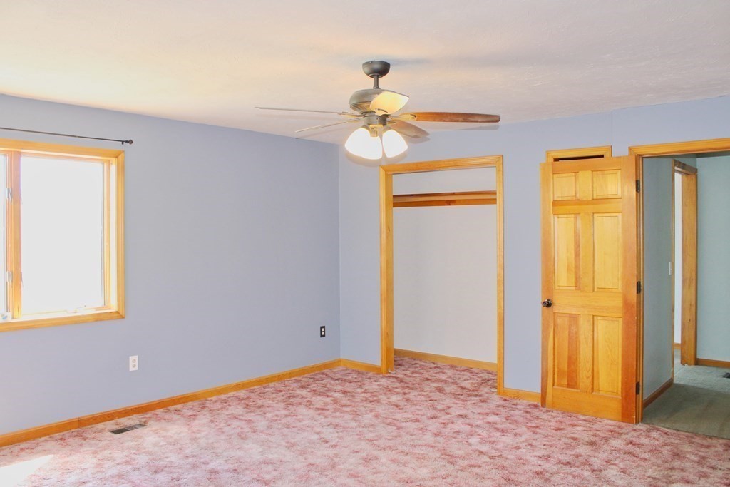 32 Hemlock Street Douglas, MA 01516 - Photo 19 of 41 a view of a room with a chandelier fan and windows