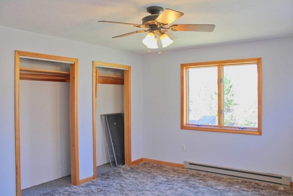 32 Hemlock Street Douglas, MA 01516 - Photo 21 of 41 a view of a livingroom with a chandelier fan