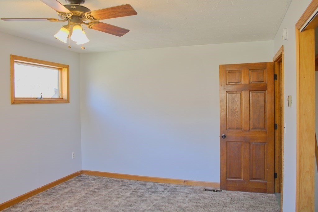 32 Hemlock Street Douglas, MA 01516 - Photo 22 of 41 an empty room with windows and fan