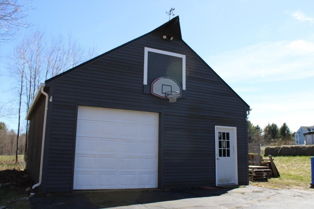 32 Hemlock Street Douglas, MA 01516 - Photo 40 of 41 a backyard of a house with seating space