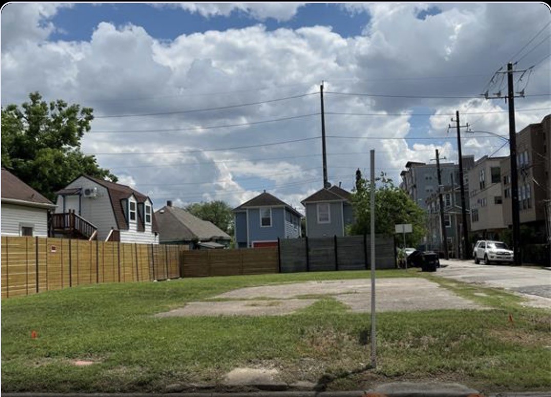 a view of a big yard in front of a house
