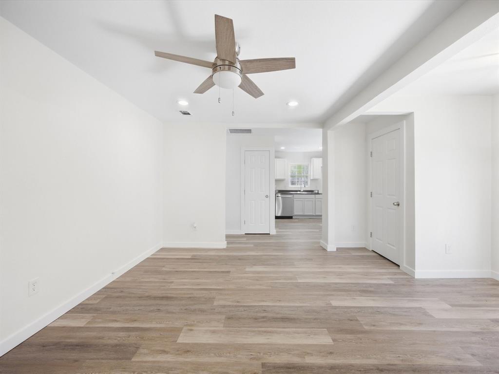 6933 Hatch Road Lake Worth, TX 76135 - Photo 11 of 28 Wood-finish flooring, recessed lighting, and a ceiling fan with integrated lighting