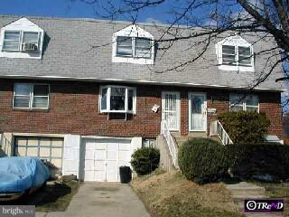 1525 Rainer Road Brookhaven, PA 19015 - Photo 1 of 1 a front view of a house with a yard