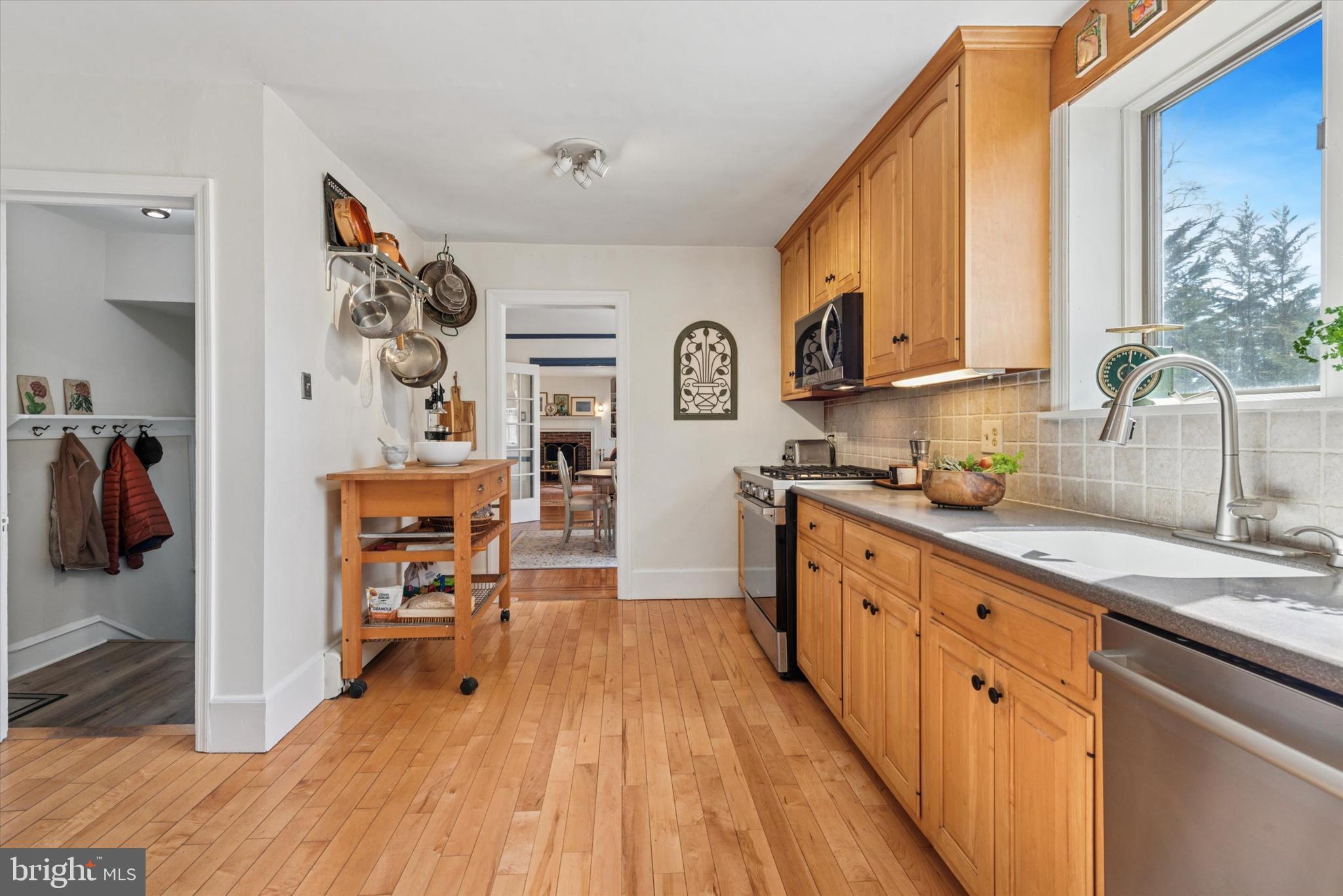 48 Old Eagle School Road Wayne, PA 19087 - Photo 13 of 33 a kitchen with stainless steel appliances granite countertop a stove a sink and a refrigerator