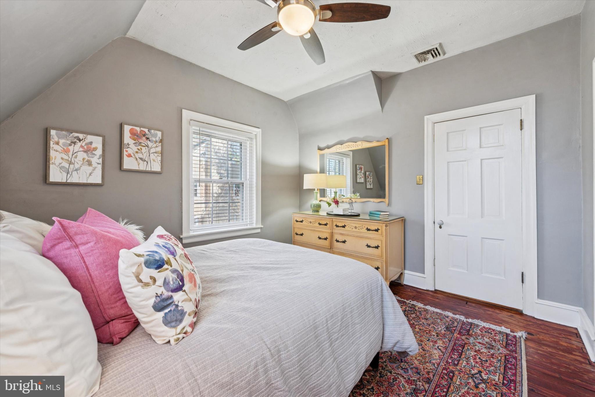 48 Old Eagle School Road Wayne, PA 19087 - Photo 20 of 33 a spacious bedroom with a bed and a chandelier