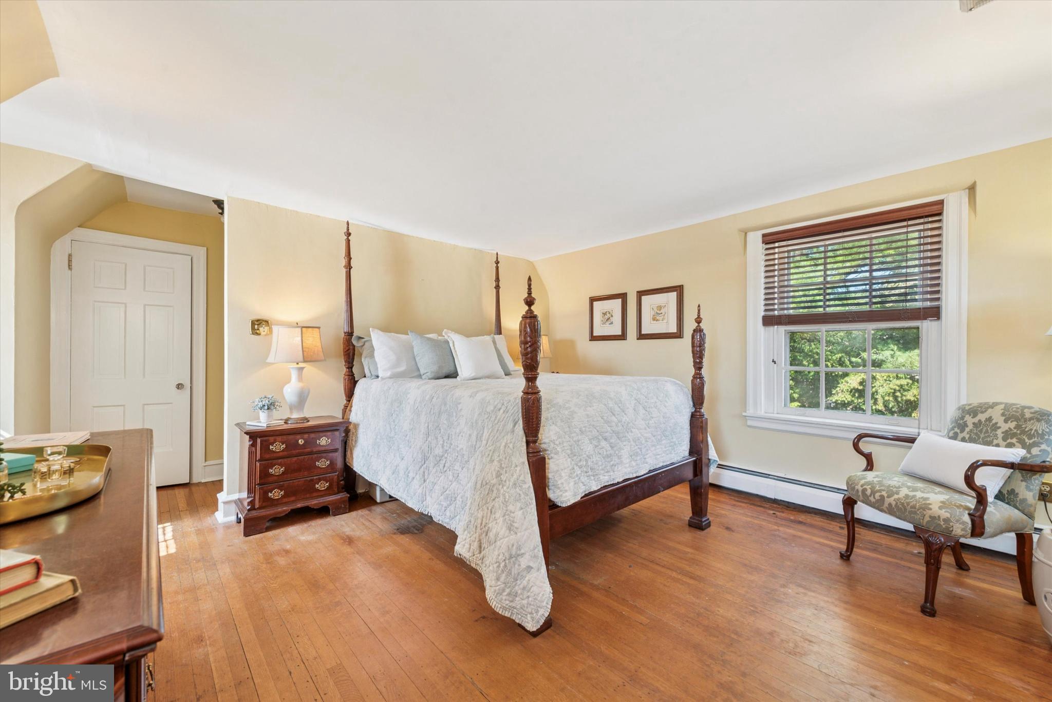 48 Old Eagle School Road Wayne, PA 19087 - Photo 27 of 33 a bed room with a bed and a chair