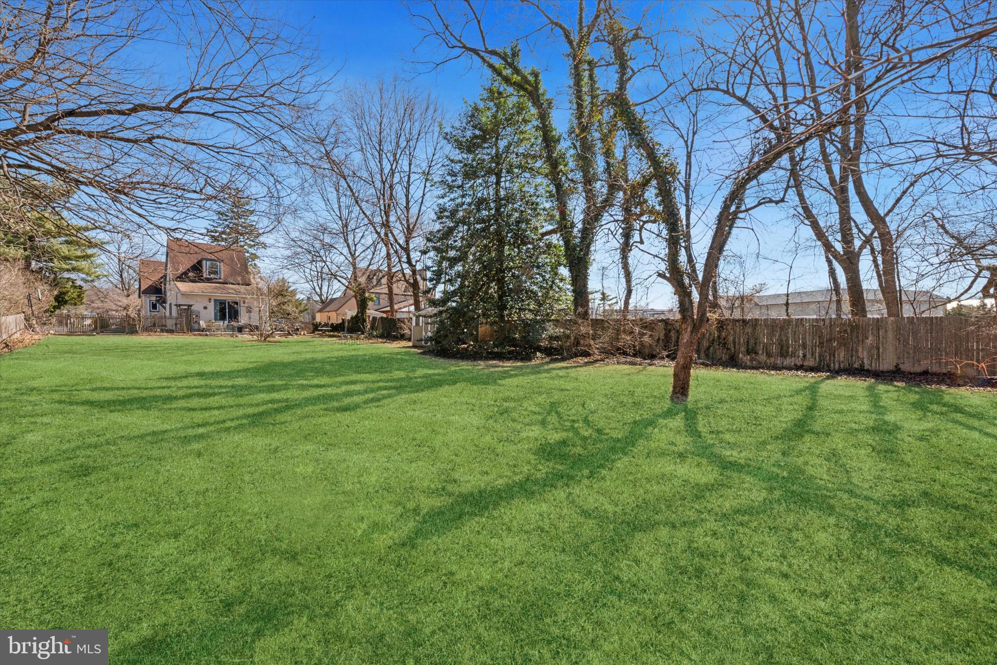 48 Old Eagle School Road Wayne, PA 19087 - Photo 30 of 33 a view of a backyard with large trees
