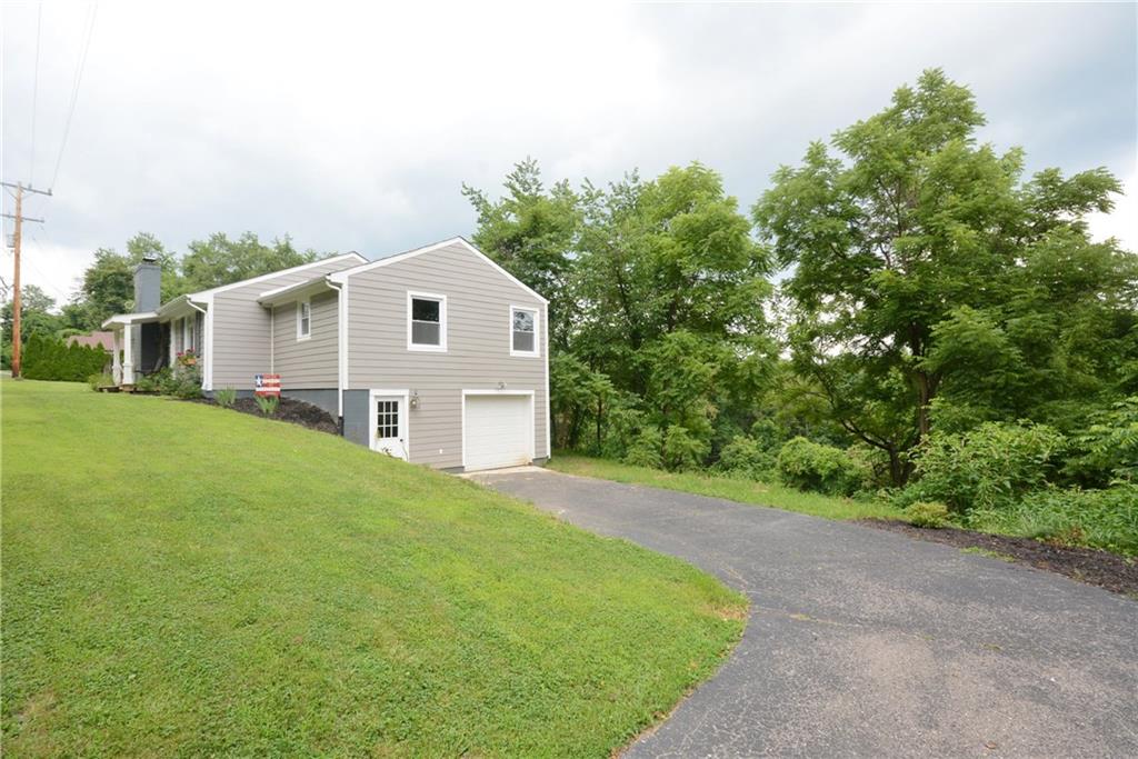 4158 Battle Ridge Road McDonald, PA 15057 - Photo 2 of 23 Large driveway to have many guests ,tandem 2 car garage with plenty of space and a mudroom with great style and storage.