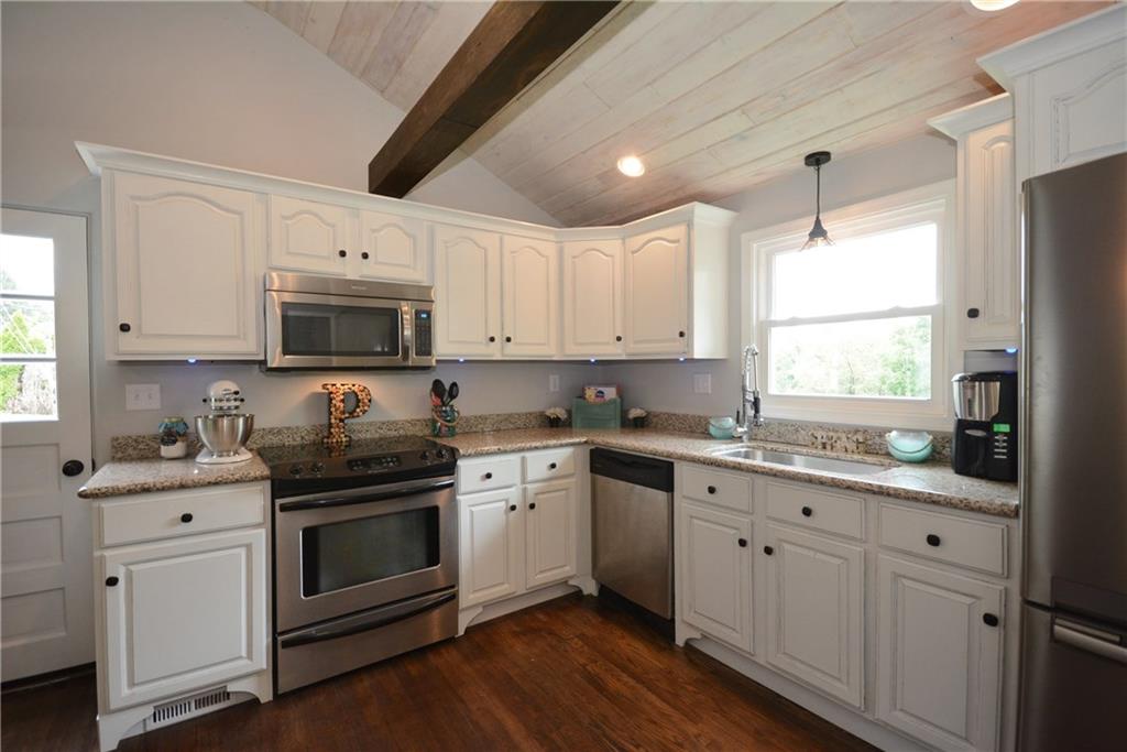 4158 Battle Ridge Road McDonald, PA 15057 - Photo 5 of 23 Bright open kitchen with custom beams and vaulted whitewashed wood ceilings and ceiling fan.