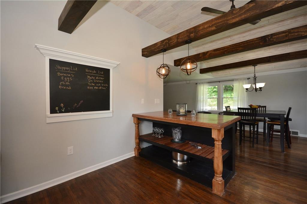 4158 Battle Ridge Road McDonald, PA 15057 - Photo 7 of 23 This custom island was created from a fallen cherry tree ,planed,stained and cut to provide a great entertaining space for parties. And don't forget the to do list, or a great medium for your little ones artwork on this custom chalkboard.