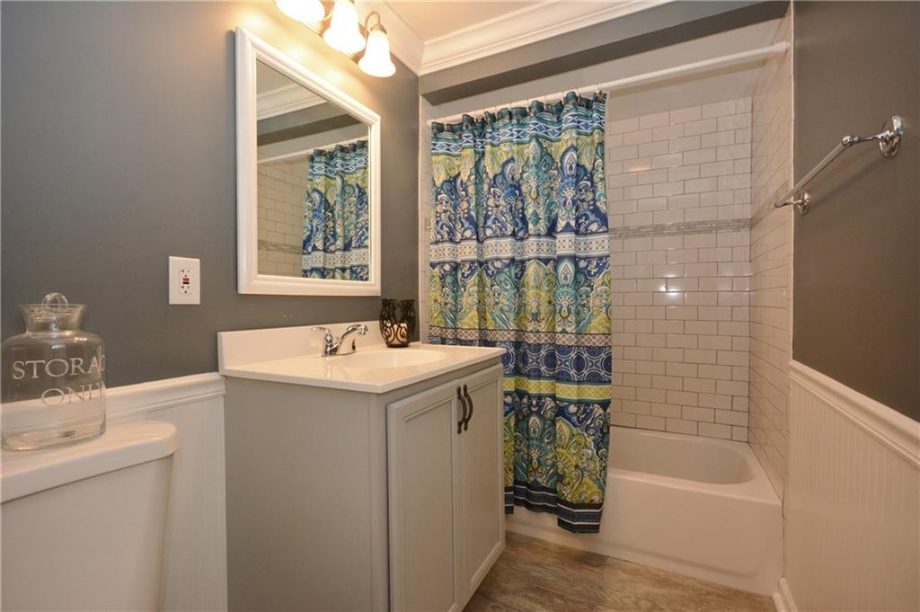 4158 Battle Ridge Road McDonald, PA 15057 - Photo 10 of 23 Second bathroom redone with white waincotting , classic subway tile and a painted in a soothing gray tones.