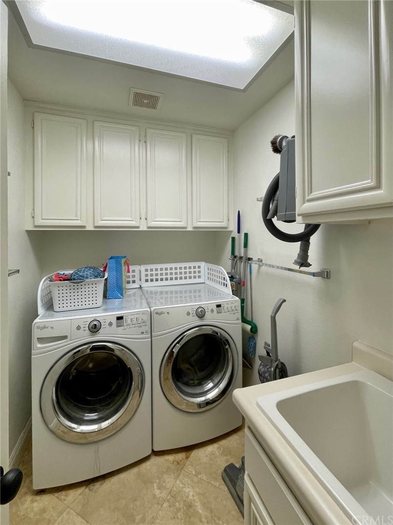 808 Carnaros San Clemente, CA 92672 - Photo 13 of 17 a utility room with sink dryer and washer