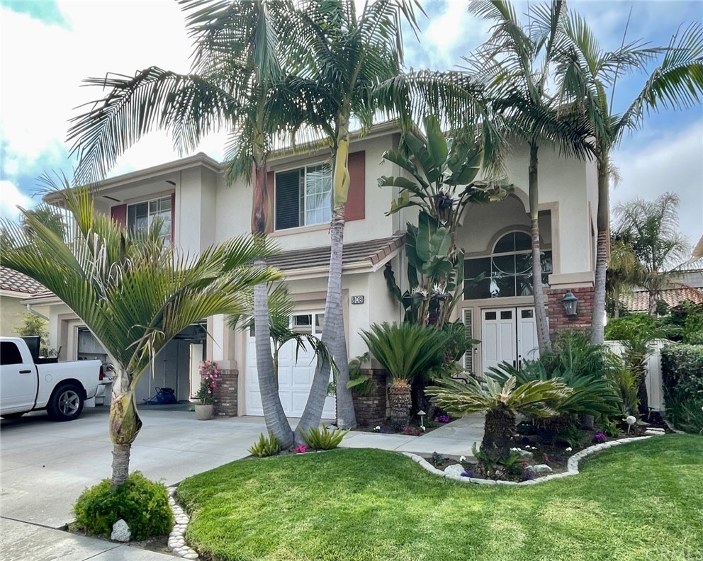 808 Carnaros San Clemente, CA 92672 - Photo 6 of 17 a front view of a house with a garden and plants