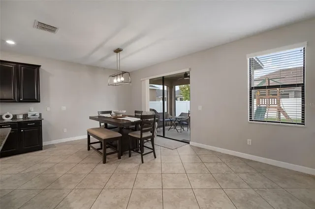 a kitchen with granite countertop stainless steel appliances and wooden cabinets