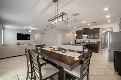 a kitchen with refrigerator and cabinets