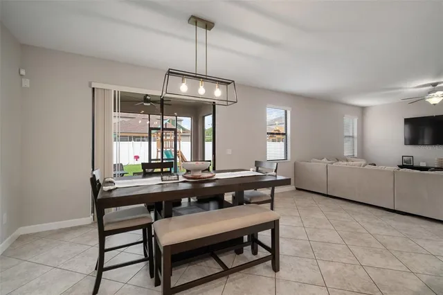 a view of a livingroom with furniture and a ceiling fan