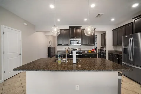 a view of an empty room with a ceiling fan