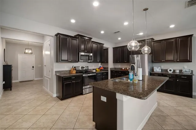 a bedroom with a bed and flowerpot