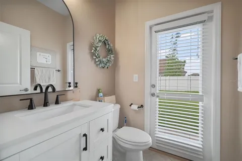 a view of walk in closet with clothes