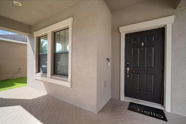 a view of a kitchen with furniture and a ceiling fan
