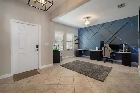 a view of a livingroom with furniture and a bathroom
