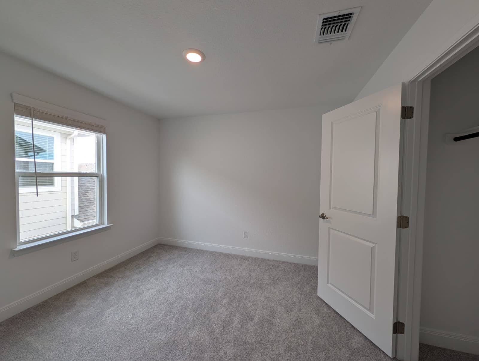 212 Daniels Dusty Trail Georgetown, TX 78626 - Photo 17 of 23 Spare room with light colored carpet and recessed lighting