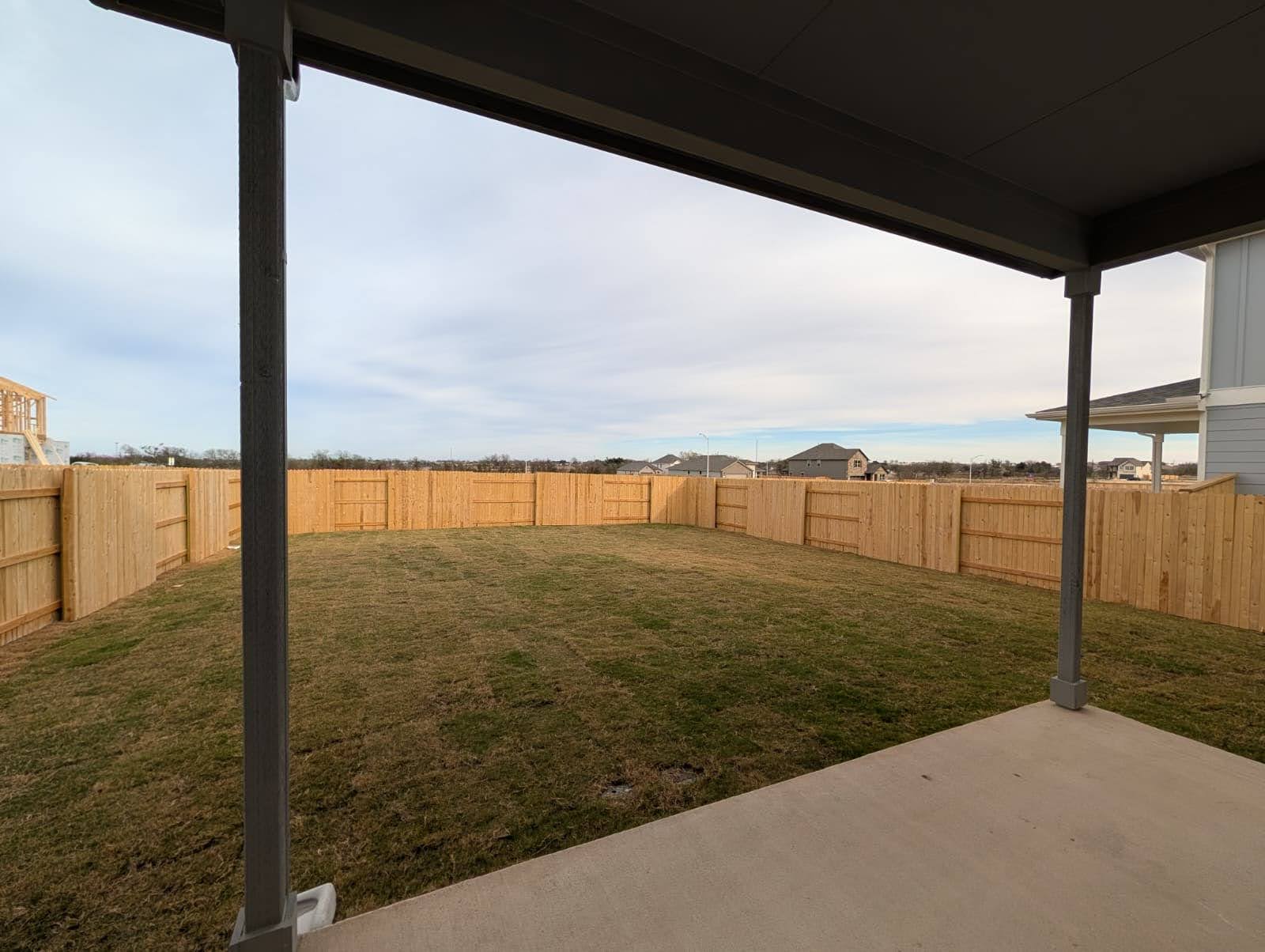 212 Daniels Dusty Trail Georgetown, TX 78626 - Photo 20 of 23 Fenced backyard with a patio area