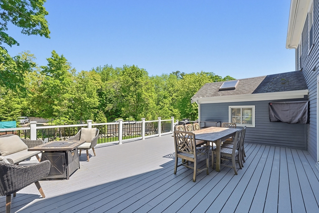 345 Sherman Street Canton, MA 02021 - Photo 34 of 42 a roof deck with table and chairs and wooden floor