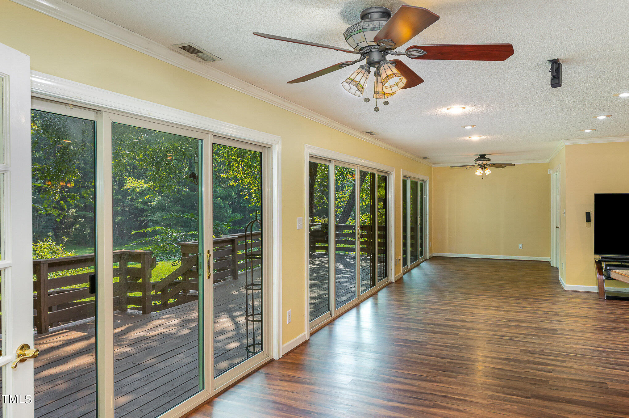 2887 Micro Road West Selma, NC 27576 - Photo 12 of 48 a view of an empty room with wooden floor and a window
