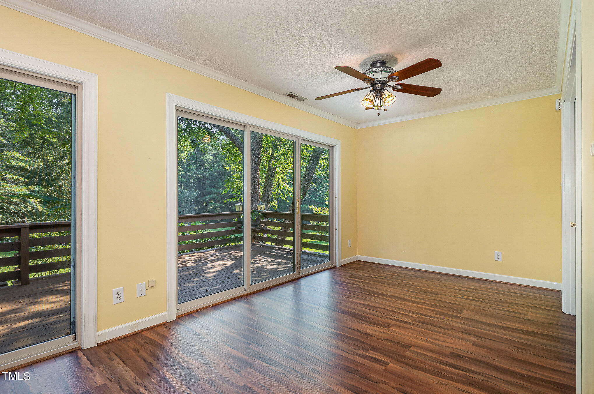 2887 Micro Road West Selma, NC 27576 - Photo 13 of 48 wooden floor in an empty room with a window