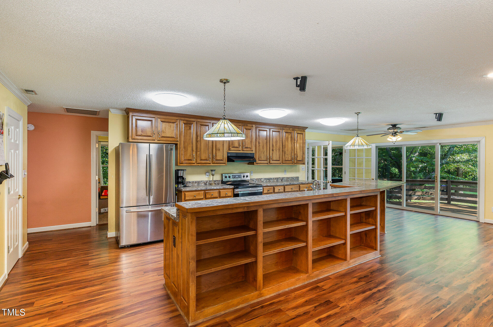 2887 Micro Road West Selma, NC 27576 - Photo 14 of 48 a large kitchen with stainless steel appliances a stove a refrigerator and wooden floor
