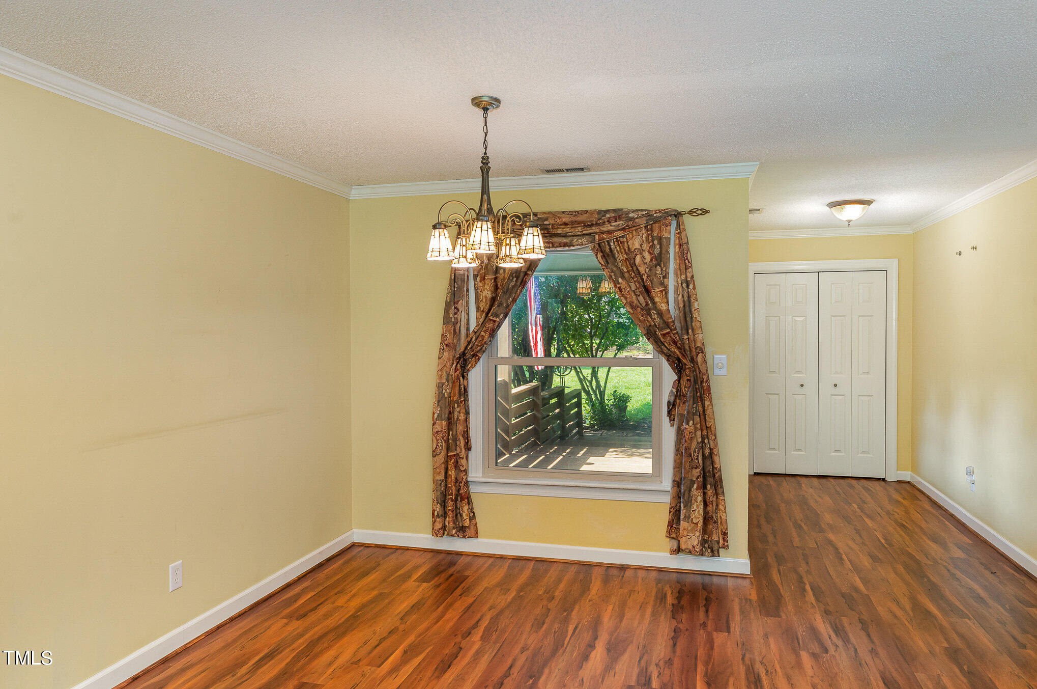 2887 Micro Road West Selma, NC 27576 - Photo 20 of 48 a view of a room with wooden floor a sink and a window