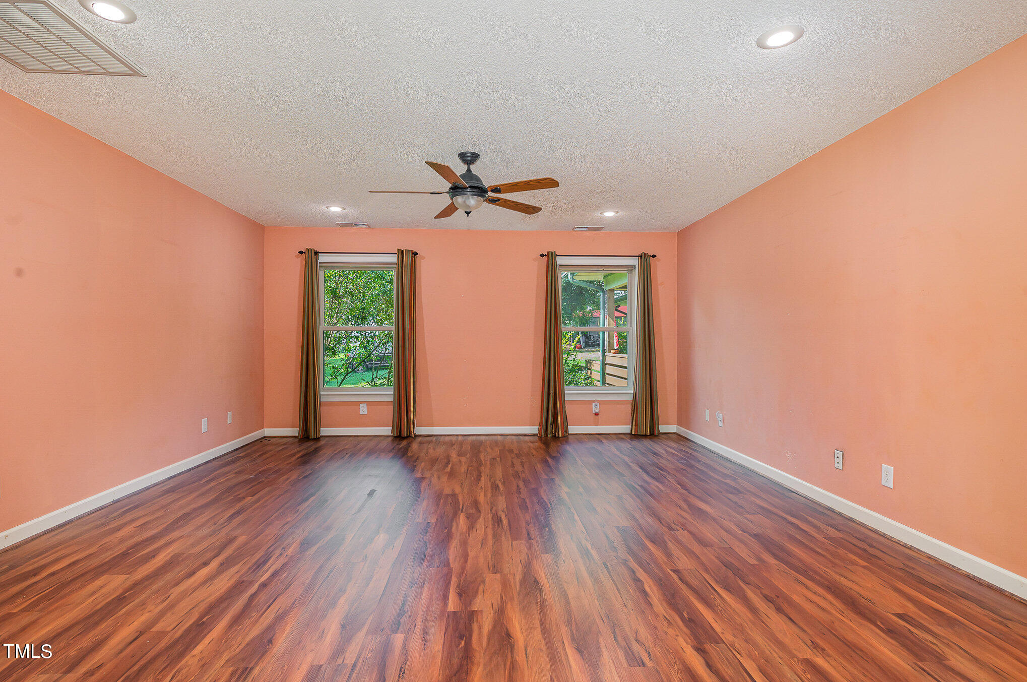 2887 Micro Road West Selma, NC 27576 - Photo 21 of 48 wooden floor in an empty room with a window