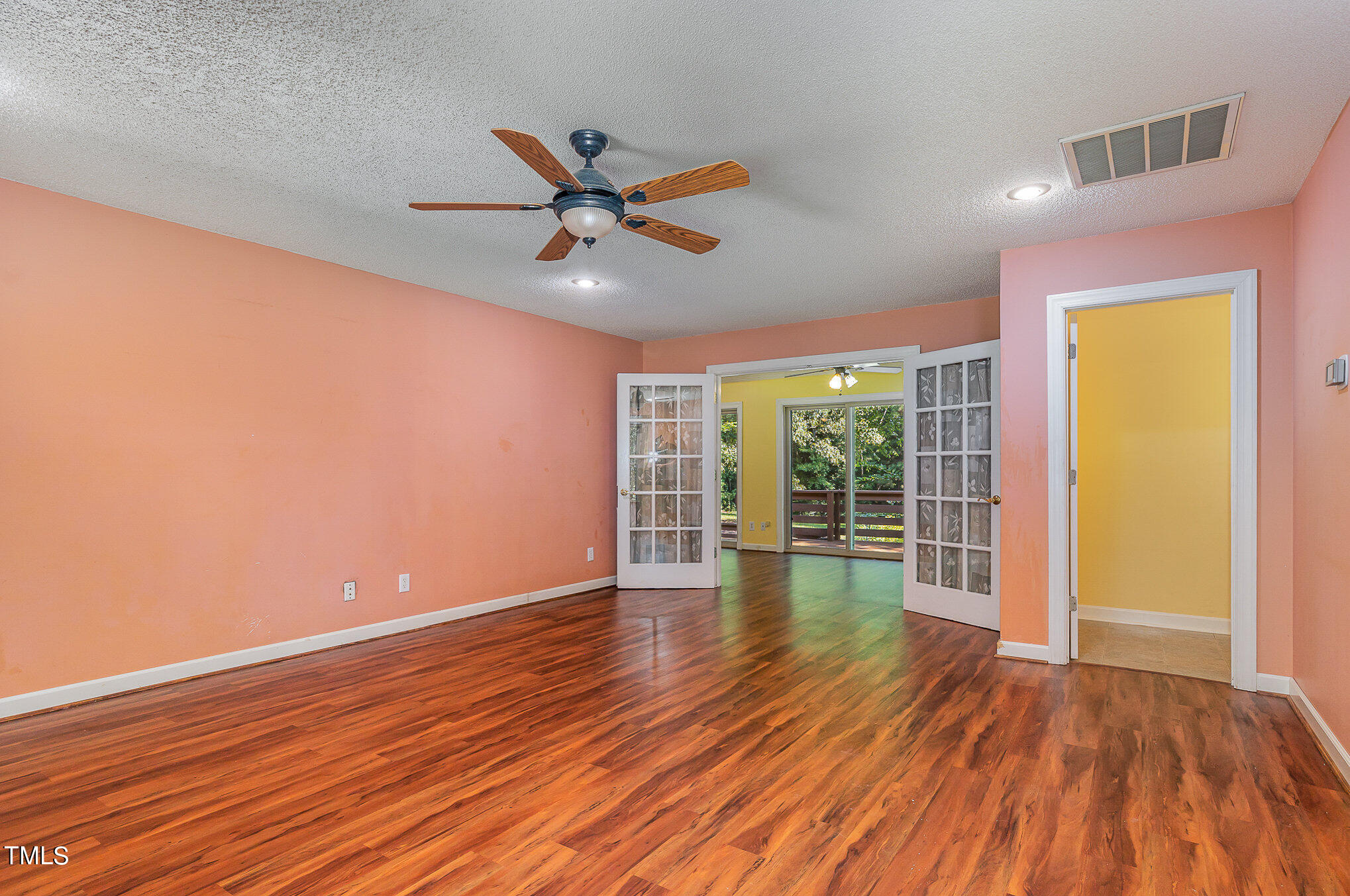 2887 Micro Road West Selma, NC 27576 - Photo 23 of 48 a view of empty room with wooden floor and fan
