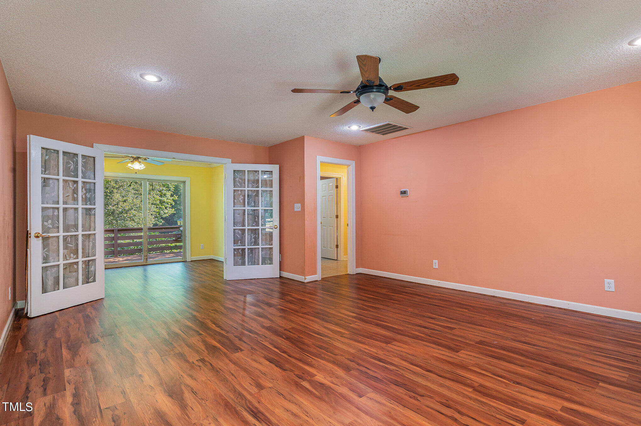 2887 Micro Road West Selma, NC 27576 - Photo 24 of 48 a view of an empty room with wooden floor and a window