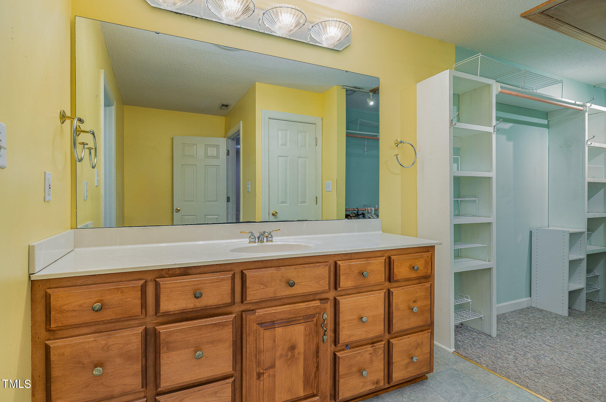 2887 Micro Road West Selma, NC 27576 - Photo 27 of 48 a bathroom with a sink and a mirror