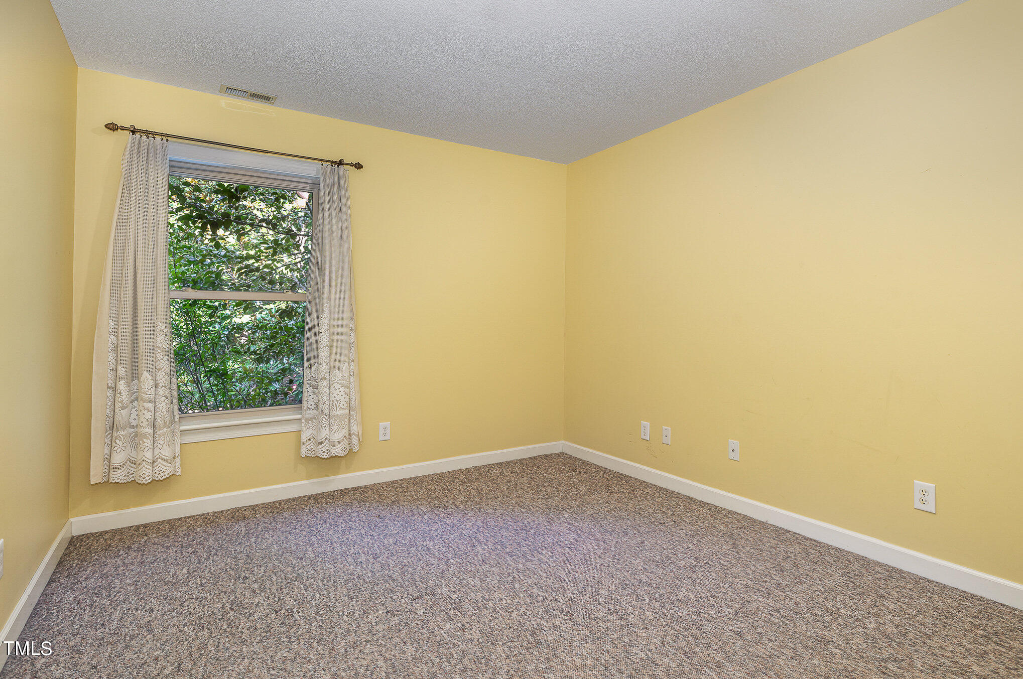 2887 Micro Road West Selma, NC 27576 - Photo 29 of 48 a view of an empty room with a window