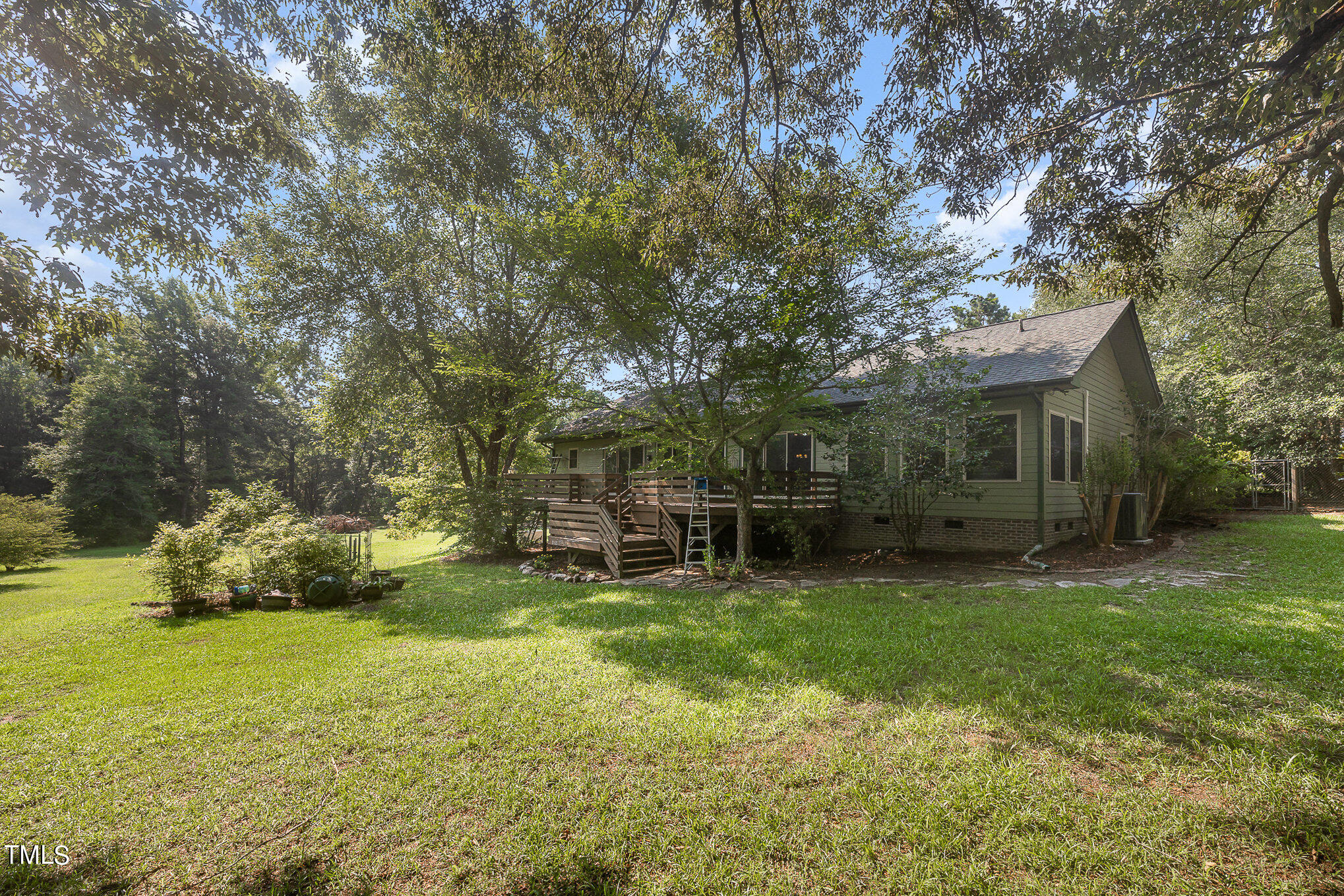 2887 Micro Road West Selma, NC 27576 - Photo 40 of 48 a backyard of a house with table and chairs