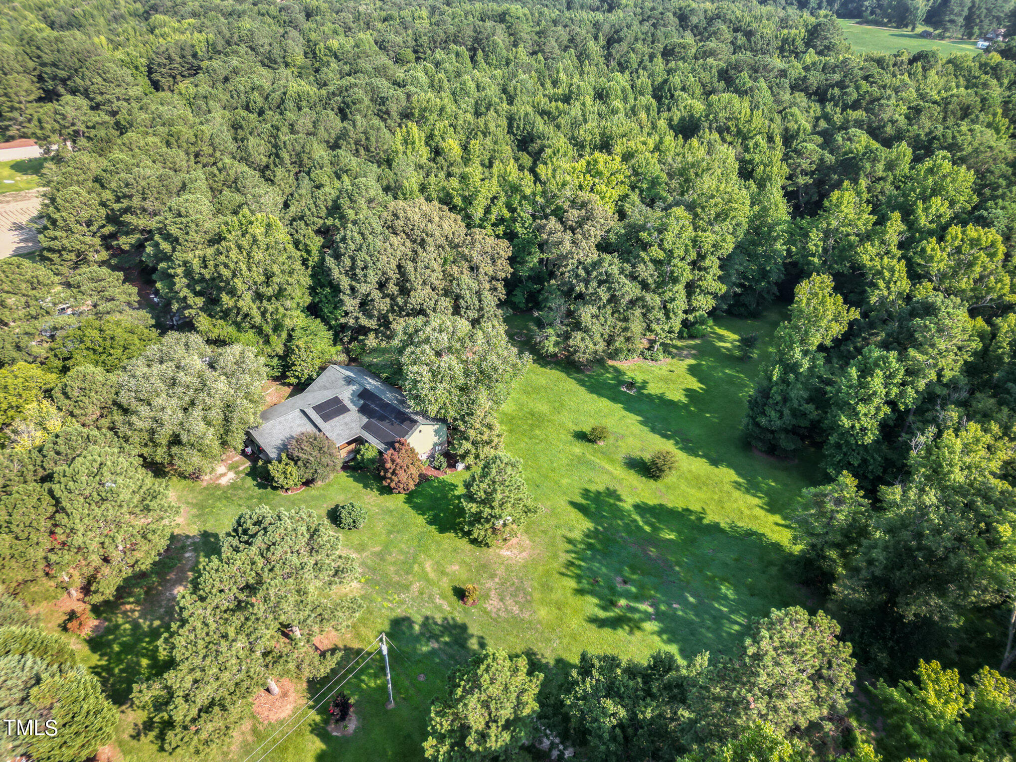 2887 Micro Road West Selma, NC 27576 - Photo 45 of 48 an aerial view of residential house with outdoor space and trees all around